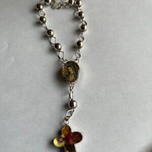 Mexican sterling silver bracelet with religious pendants.